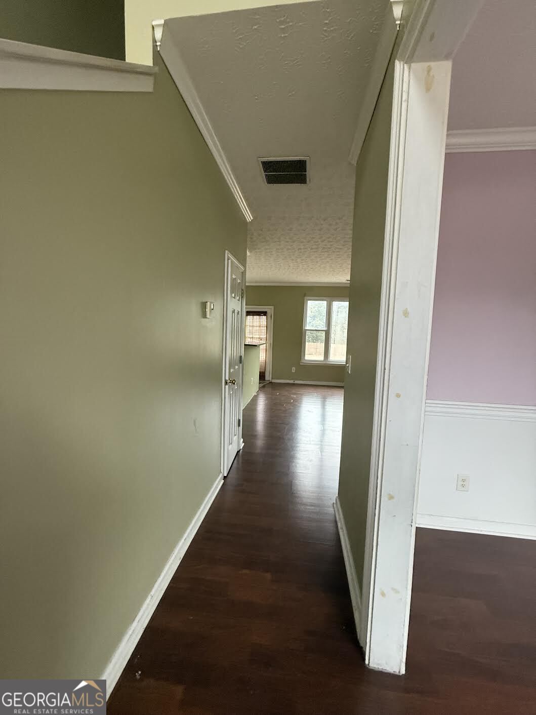 965 Trotters Farm Road Fairburn, GA 30213 - Photo 6 of 6 a view of a hallway with wooden floor and staircase