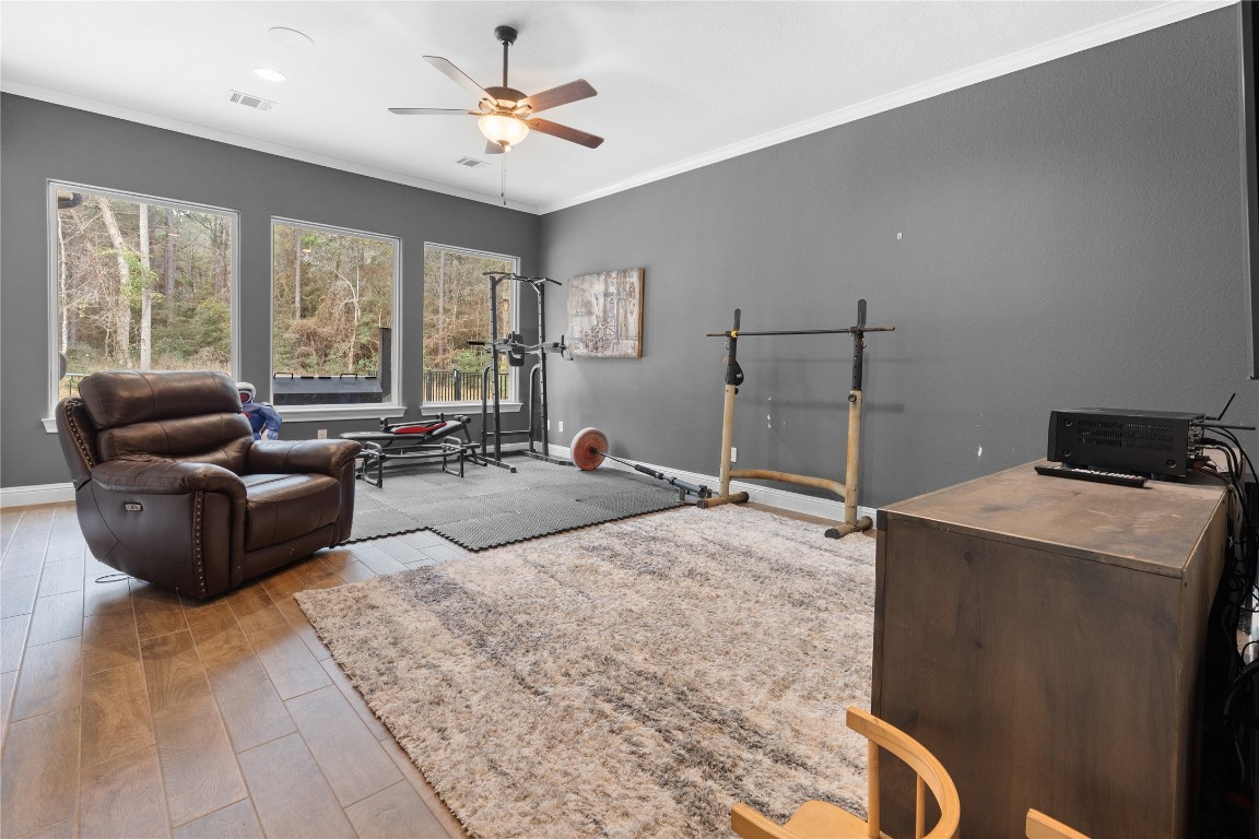 141 Sundog Road Huntsville, TX 77340 - Photo 13 of 49 a living room with furniture and large windows