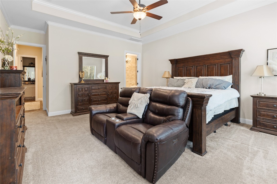 141 Sundog Road Huntsville, TX 77340 - Photo 17 of 49 a bed room with a bed and a couch