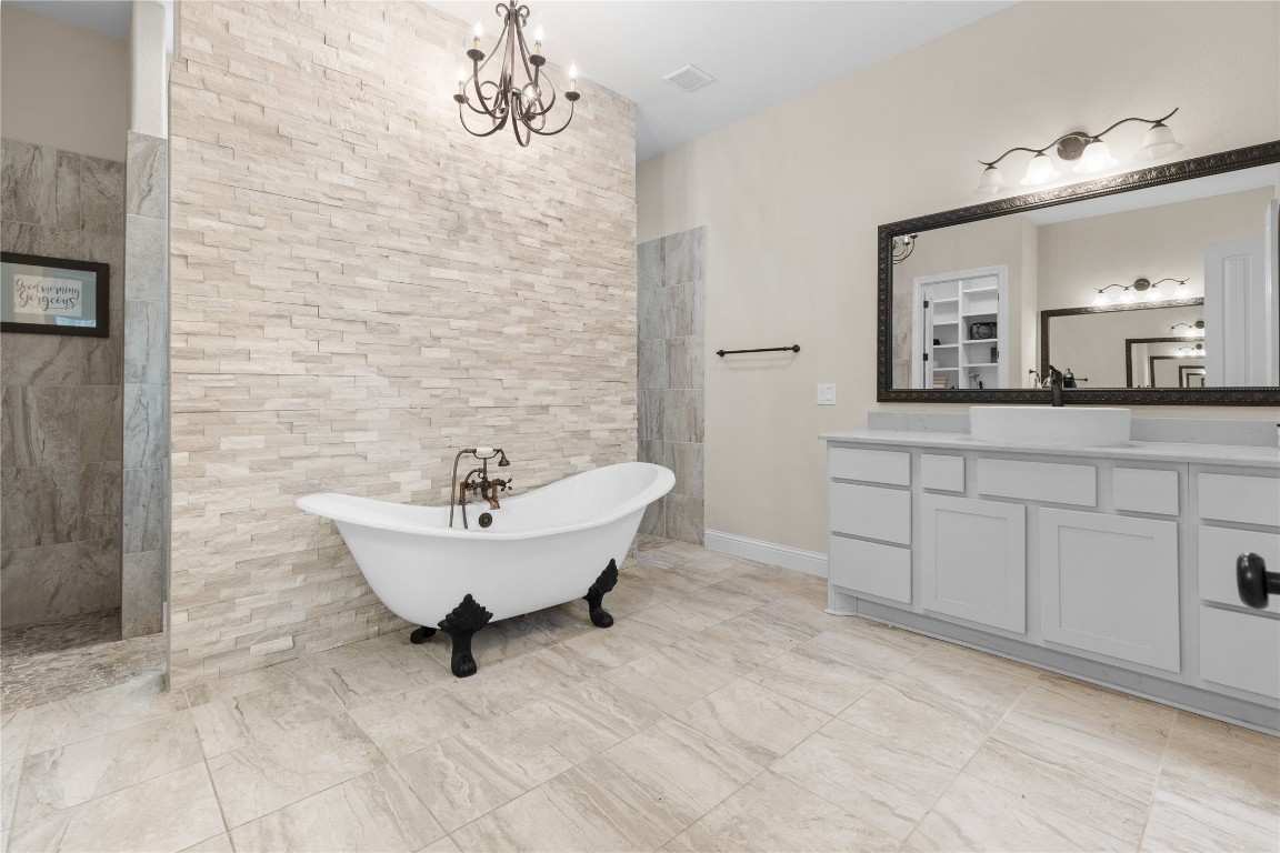 141 Sundog Road Huntsville, TX 77340 - Photo 18 of 49 a bathroom with a sink and a mirror