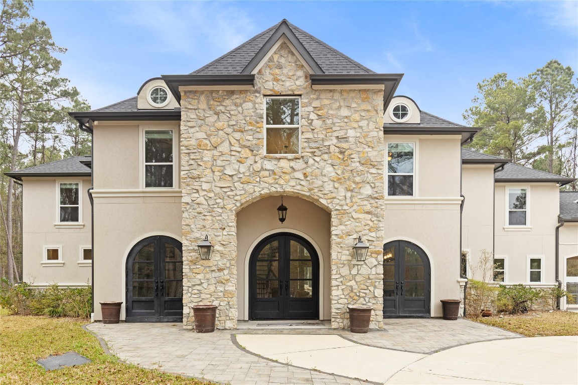 141 Sundog Road Huntsville, TX 77340 - Photo 2 of 49 a front view of a house with yard