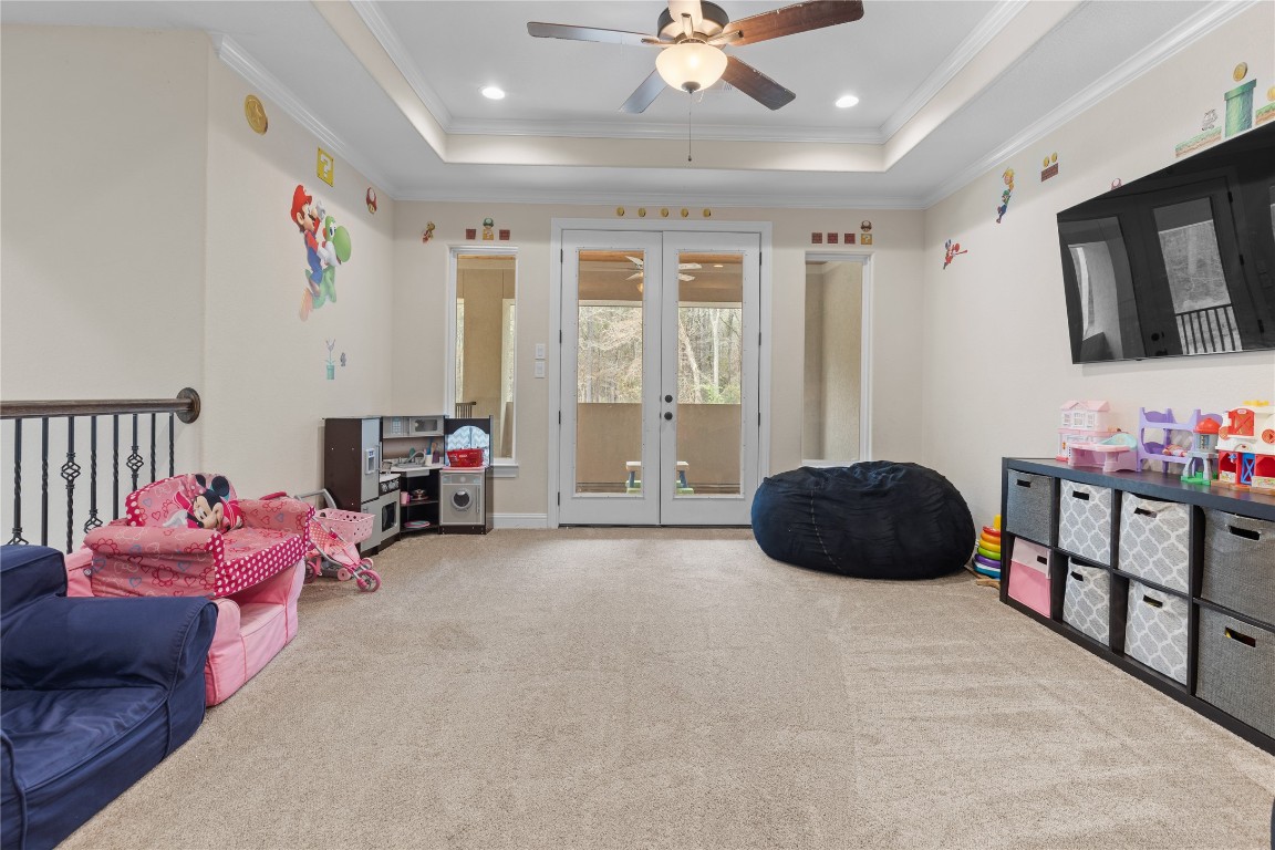 141 Sundog Road Huntsville, TX 77340 - Photo 24 of 49 a bedroom with furniture and a large window