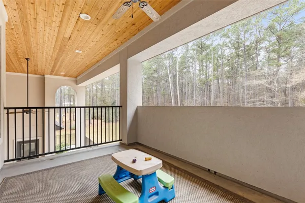 a view of a room with furniture and wooden floor