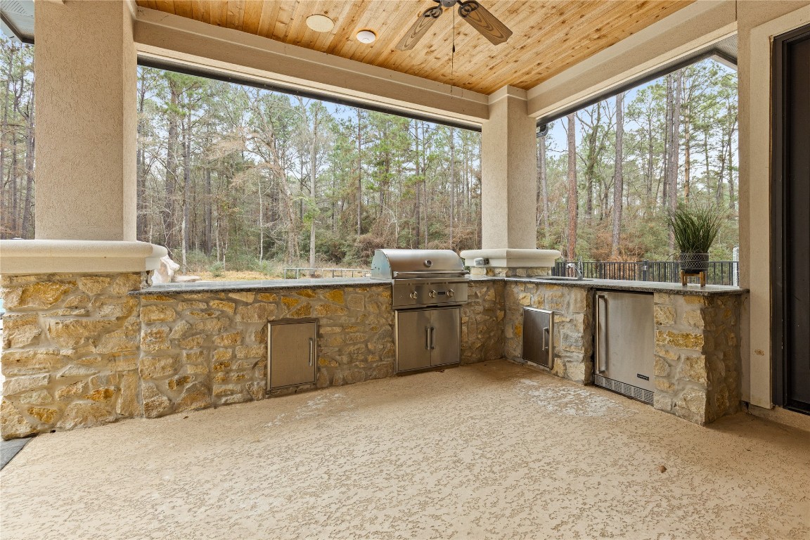 141 Sundog Road Huntsville, TX 77340 - Photo 37 of 49 a kitchen with sink cabinets and outdoor view