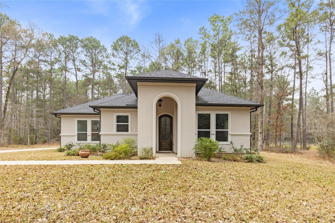 141 Sundog Road Huntsville, TX 77340 - Photo 40 of 49 a front view of a house with garden