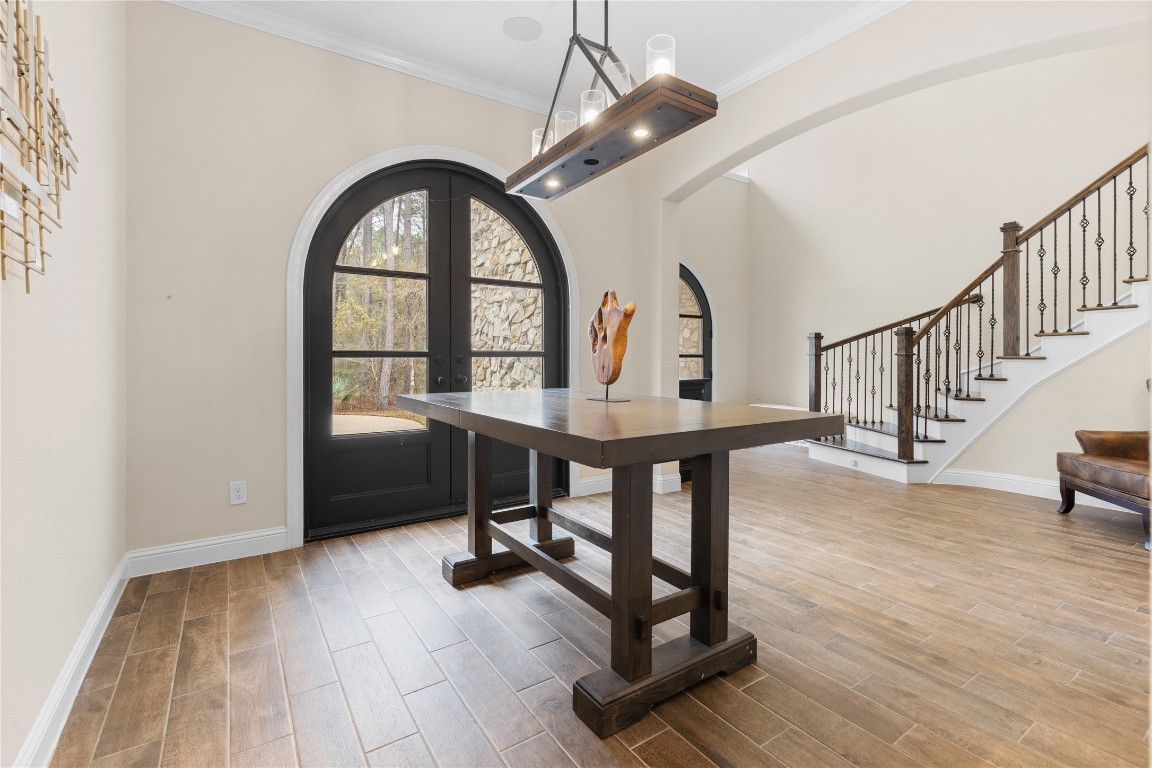 141 Sundog Road Huntsville, TX 77340 - Photo 4 of 49 a view of entryway dining room and hall with wooden floor