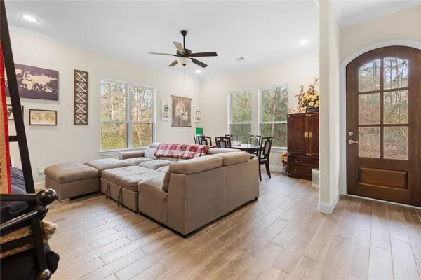 a living room with furniture and a window