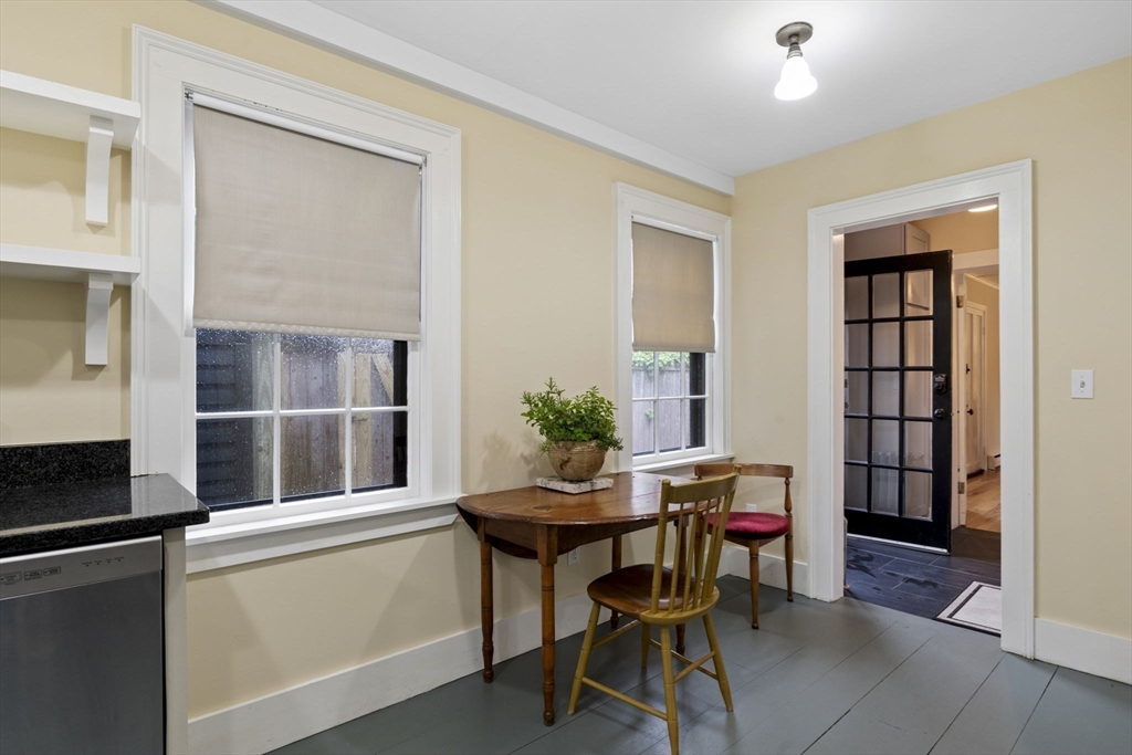 112 Federal Street, Unit 1 Salem, MA 01970 - Photo 11 of 42 a view of a workspace with furniture and a window