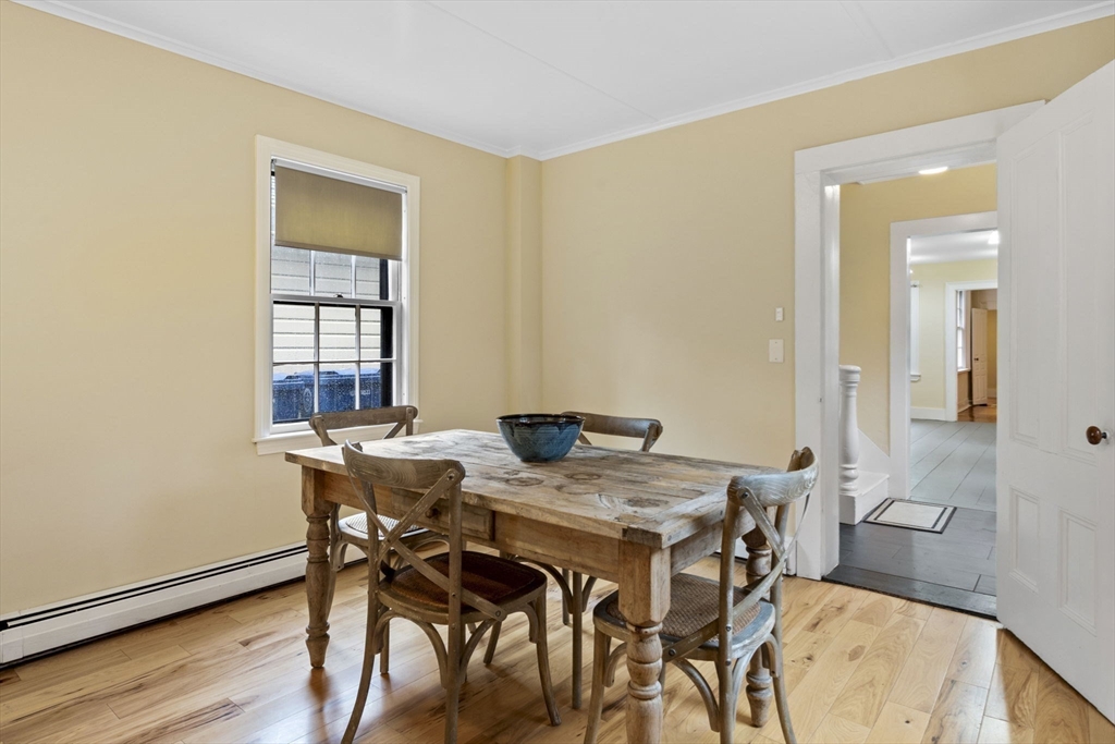 112 Federal Street, Unit 1 Salem, MA 01970 - Photo 14 of 42 a view of a dining room with furniture and wooden floor