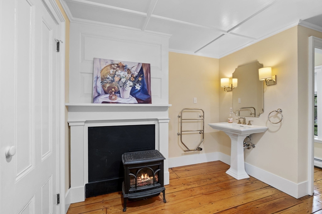 112 Federal Street, Unit 1 Salem, MA 01970 - Photo 21 of 42 a view of a livingroom with a fireplace and staircase