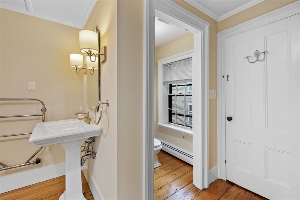 112 Federal Street, Unit 1 Salem, MA 01970 - Photo 25 of 42 a bathroom with a sink a mirror and a shower