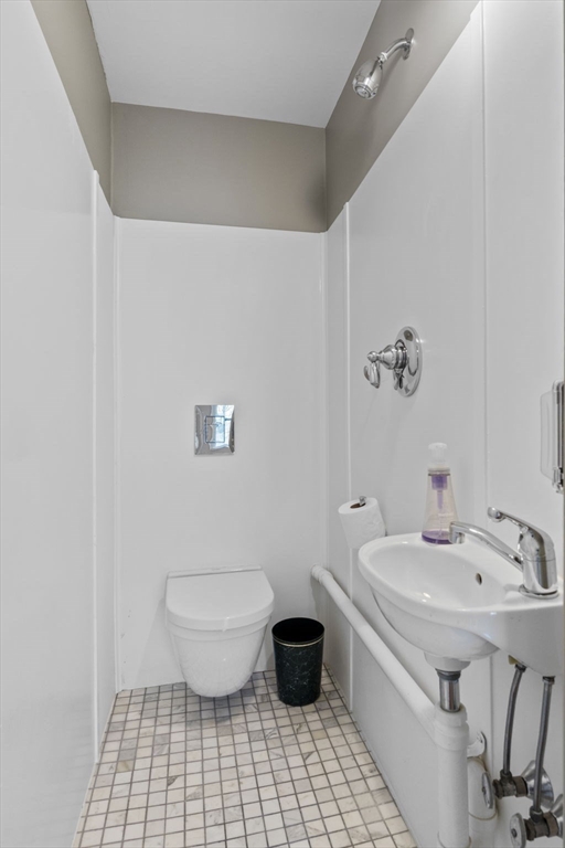 112 Federal Street, Unit 1 Salem, MA 01970 - Photo 28 of 42 a bathroom with a sink a toilet and a mirror