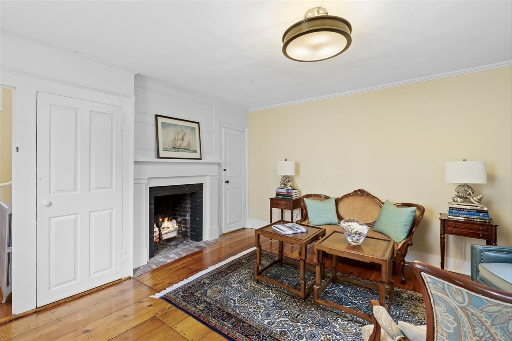 112 Federal Street, Unit 1 Salem, MA 01970 - Photo 3 of 42 a living room with furniture and a fireplace
