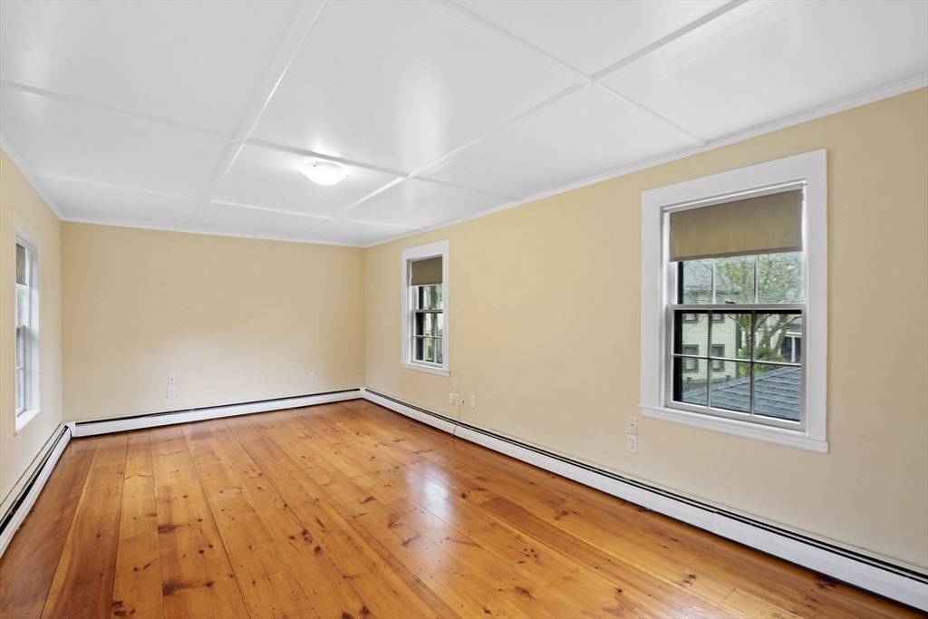 112 Federal Street, Unit 1 Salem, MA 01970 - Photo 32 of 42 a view of empty room with wooden floor and fan