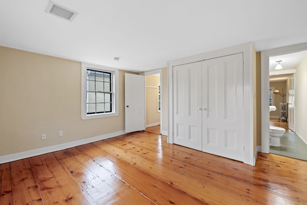 112 Federal Street, Unit 1 Salem, MA 01970 - Photo 35 of 42 wooden floor in an empty room with a window