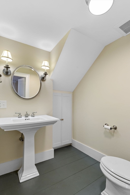 112 Federal Street, Unit 1 Salem, MA 01970 - Photo 5 of 42 a bathroom with a toilet sink and mirror