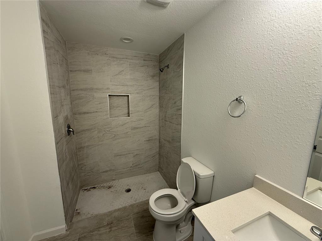 1288 Nackman Road North Port, FL 34288 - Photo 11 of 29 a bathroom with a toilet and a shower