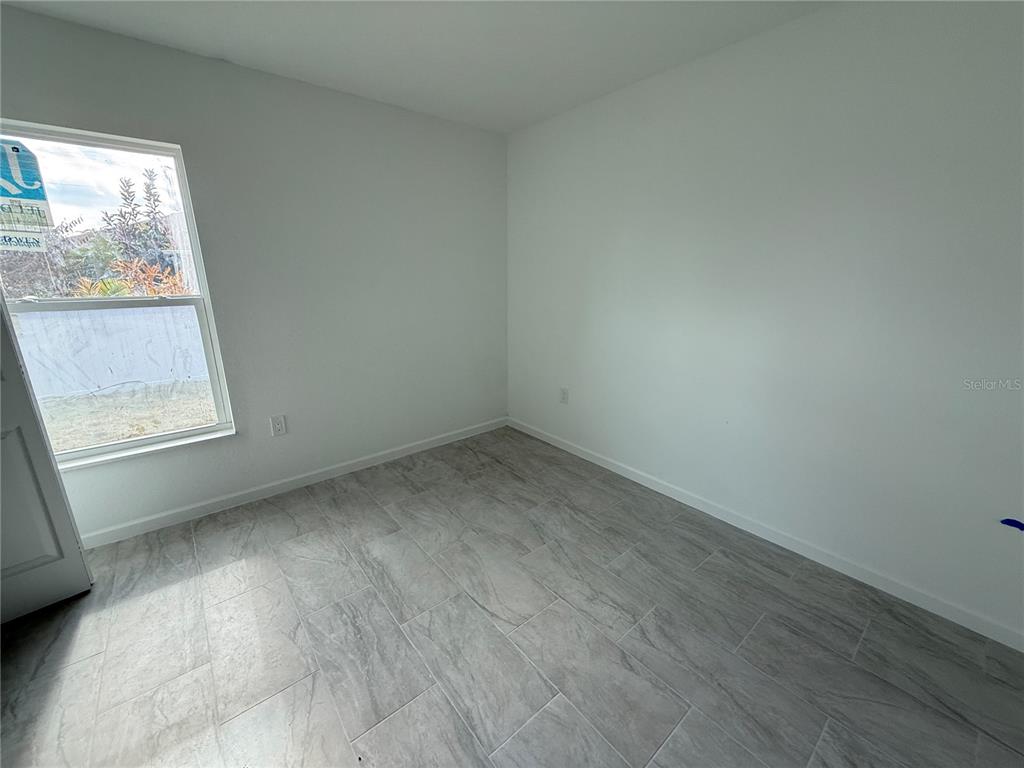 1288 Nackman Road North Port, FL 34288 - Photo 19 of 29 an empty room with a window