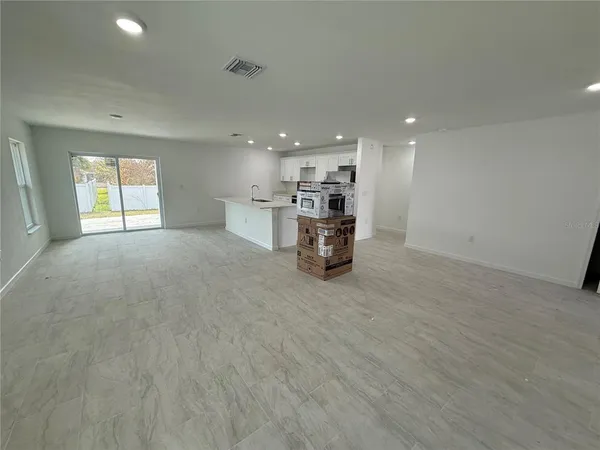 a view of work space with furniture and window