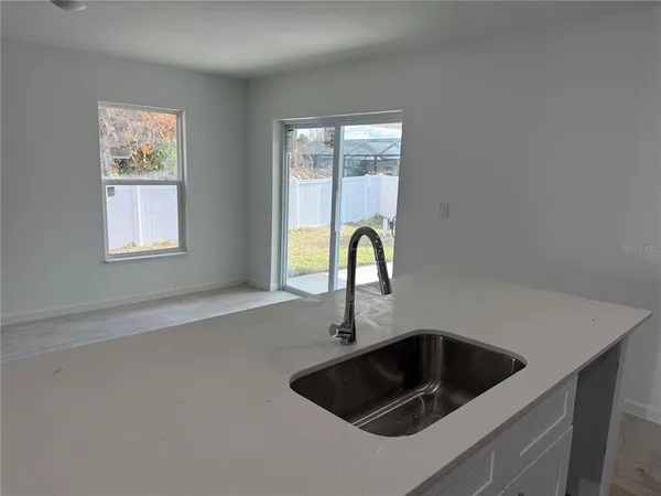 a kitchen with a sink and a window