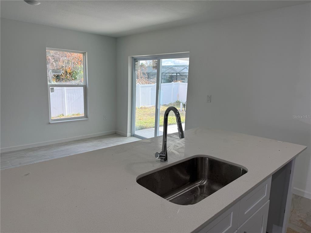 1288 Nackman Road North Port, FL 34288 - Photo 9 of 29 a kitchen with a sink and a window