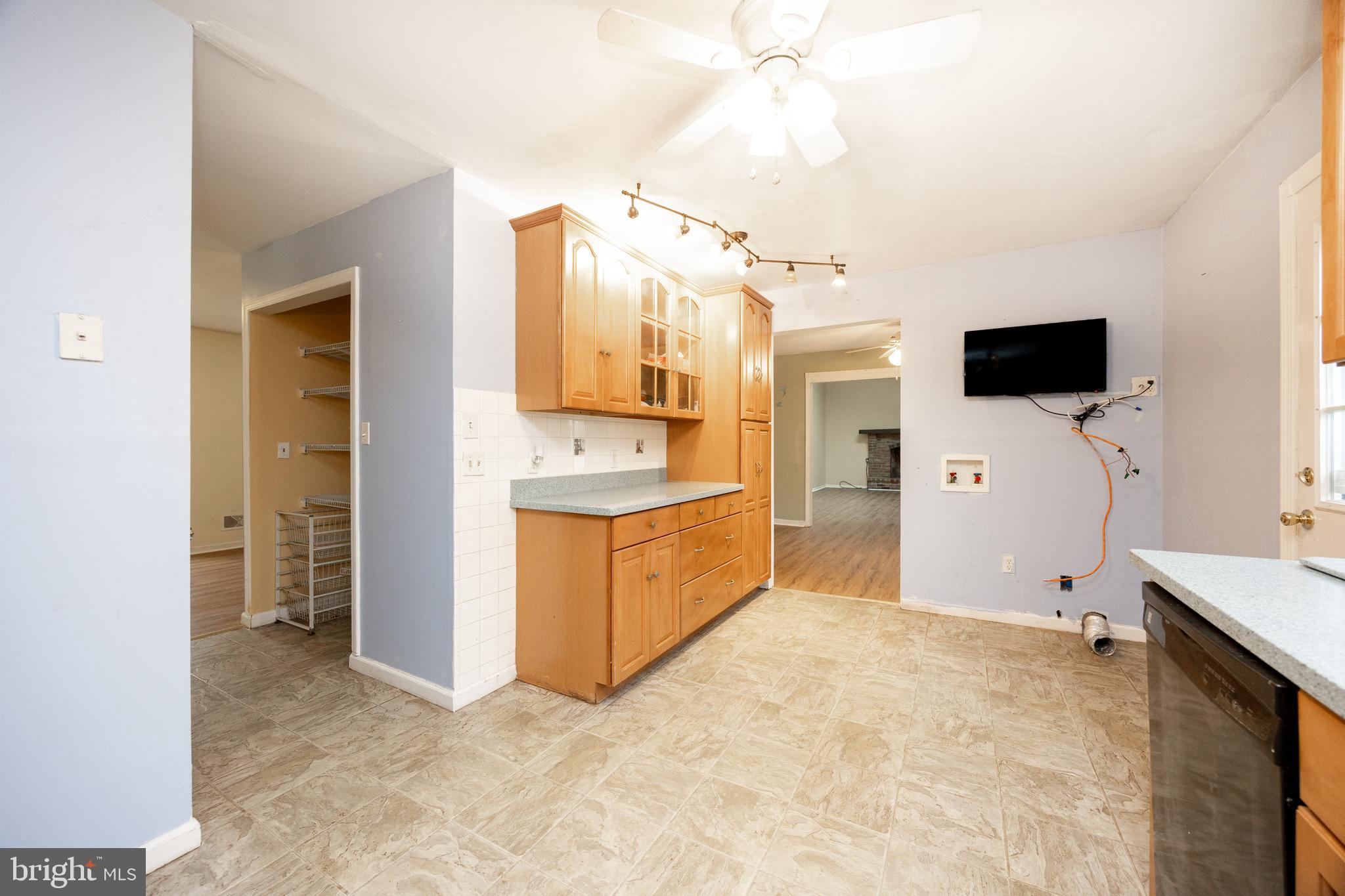 175 Levengood Road Douglassville, PA 19518 - Photo 11 of 33 a view of kitchen with stainless steel appliances kitchen island a sink a refrigerator and a flat screen tv