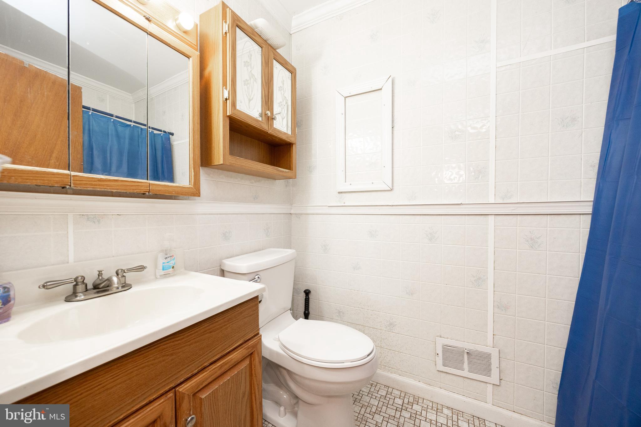 175 Levengood Road Douglassville, PA 19518 - Photo 21 of 33 a bathroom with a sink a toilet and mirror