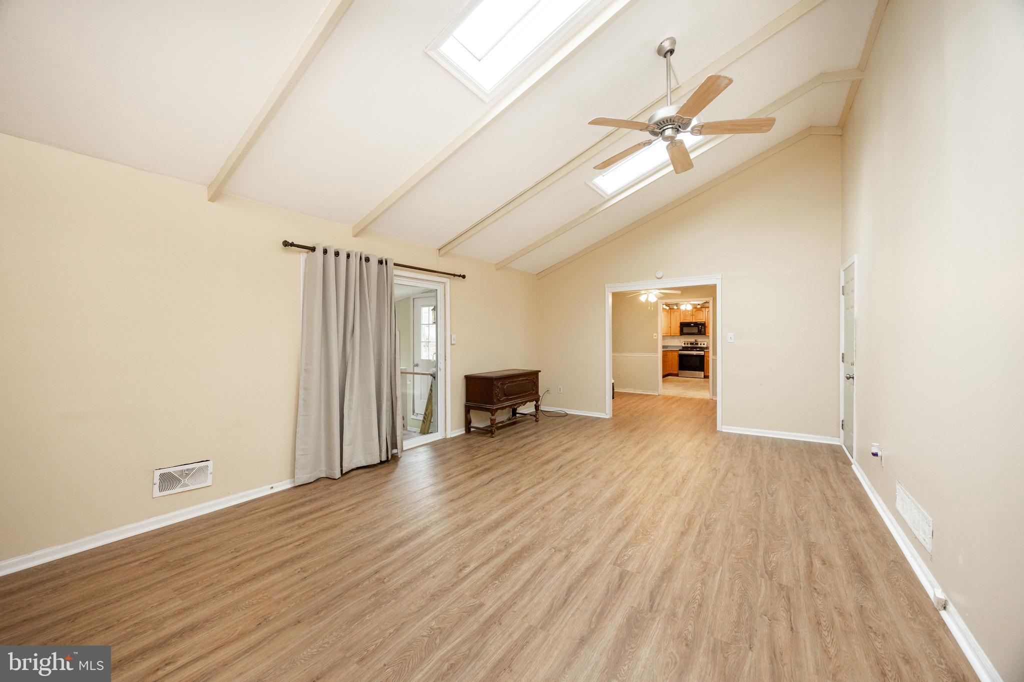 175 Levengood Road Douglassville, PA 19518 - Photo 4 of 33 wooden floor in an empty room with a window