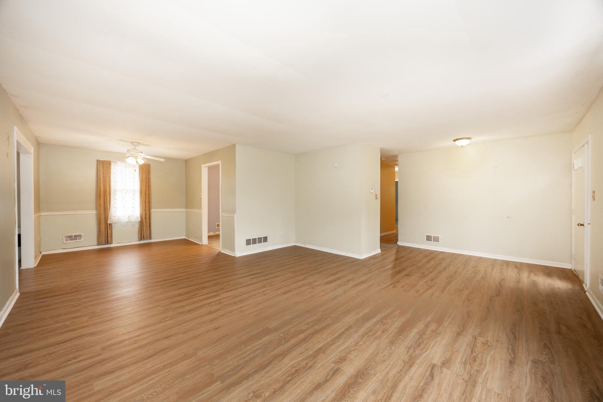 175 Levengood Road Douglassville, PA 19518 - Photo 6 of 33 a view of an empty room with wooden floor and a window