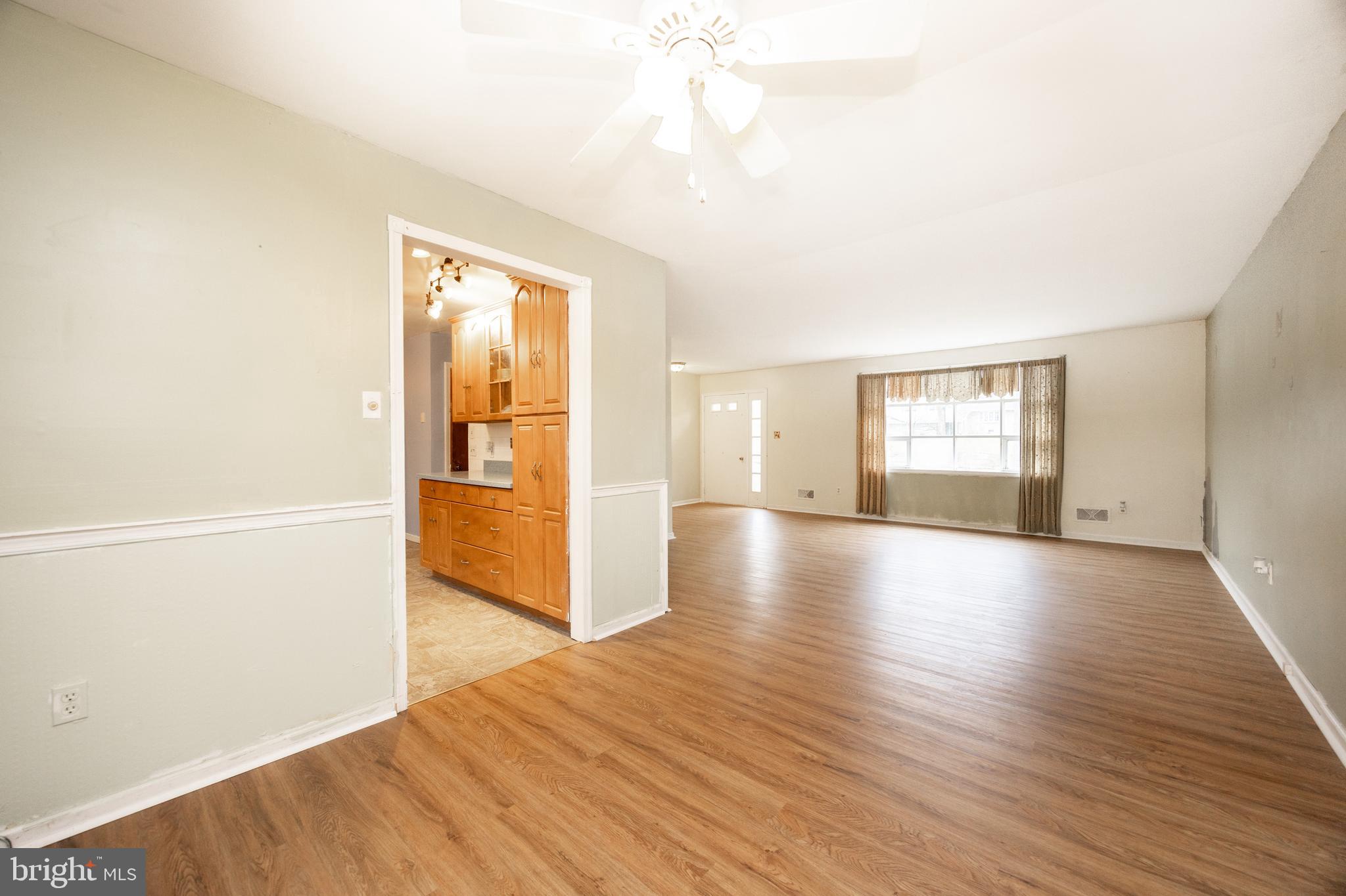 175 Levengood Road Douglassville, PA 19518 - Photo 8 of 33 a view of an empty room with window and wooden floor