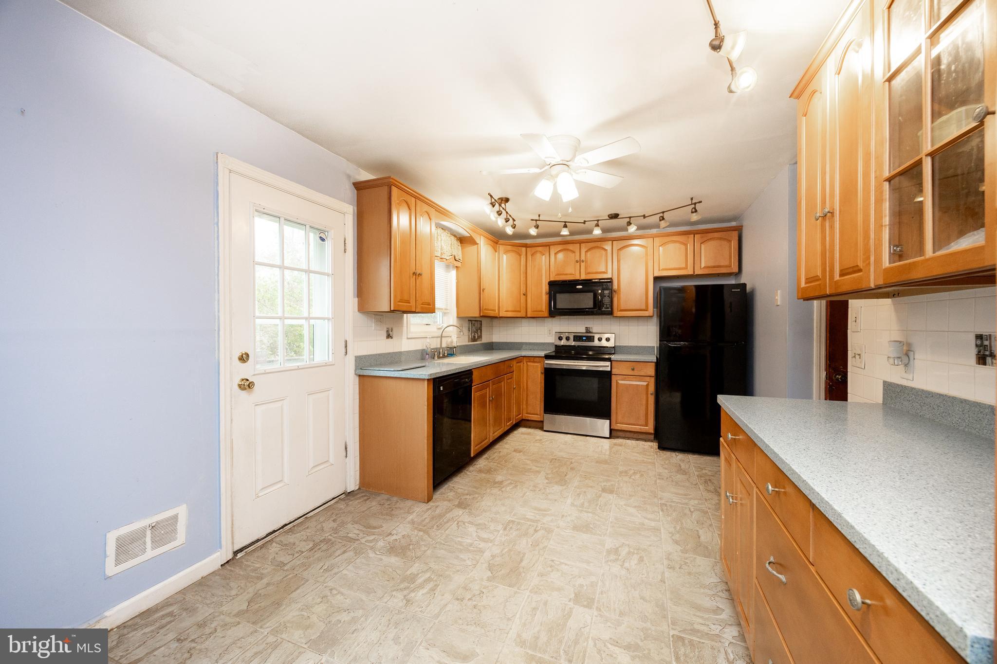 175 Levengood Road Douglassville, PA 19518 - Photo 9 of 33 a large kitchen with cabinets and stainless steel appliances