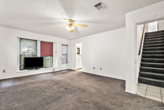 wooden floor in an empty room with a fireplace
