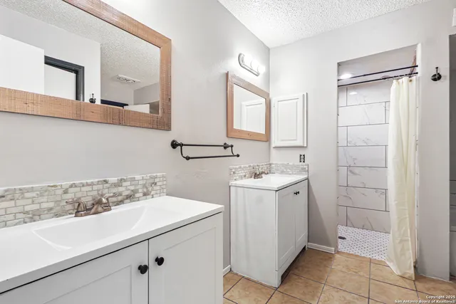 a bathroom with a sink a toilet and mirror