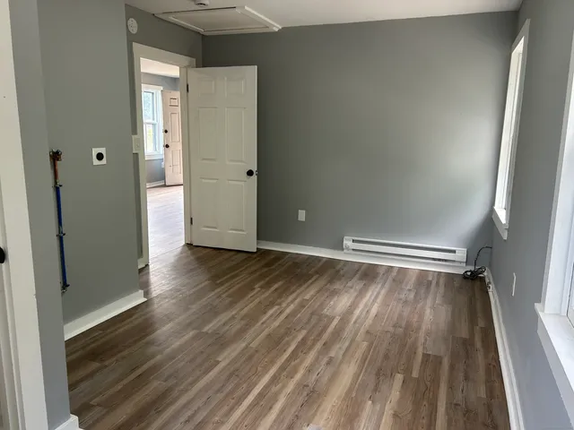 a bathroom with a sink toilet and a mirror