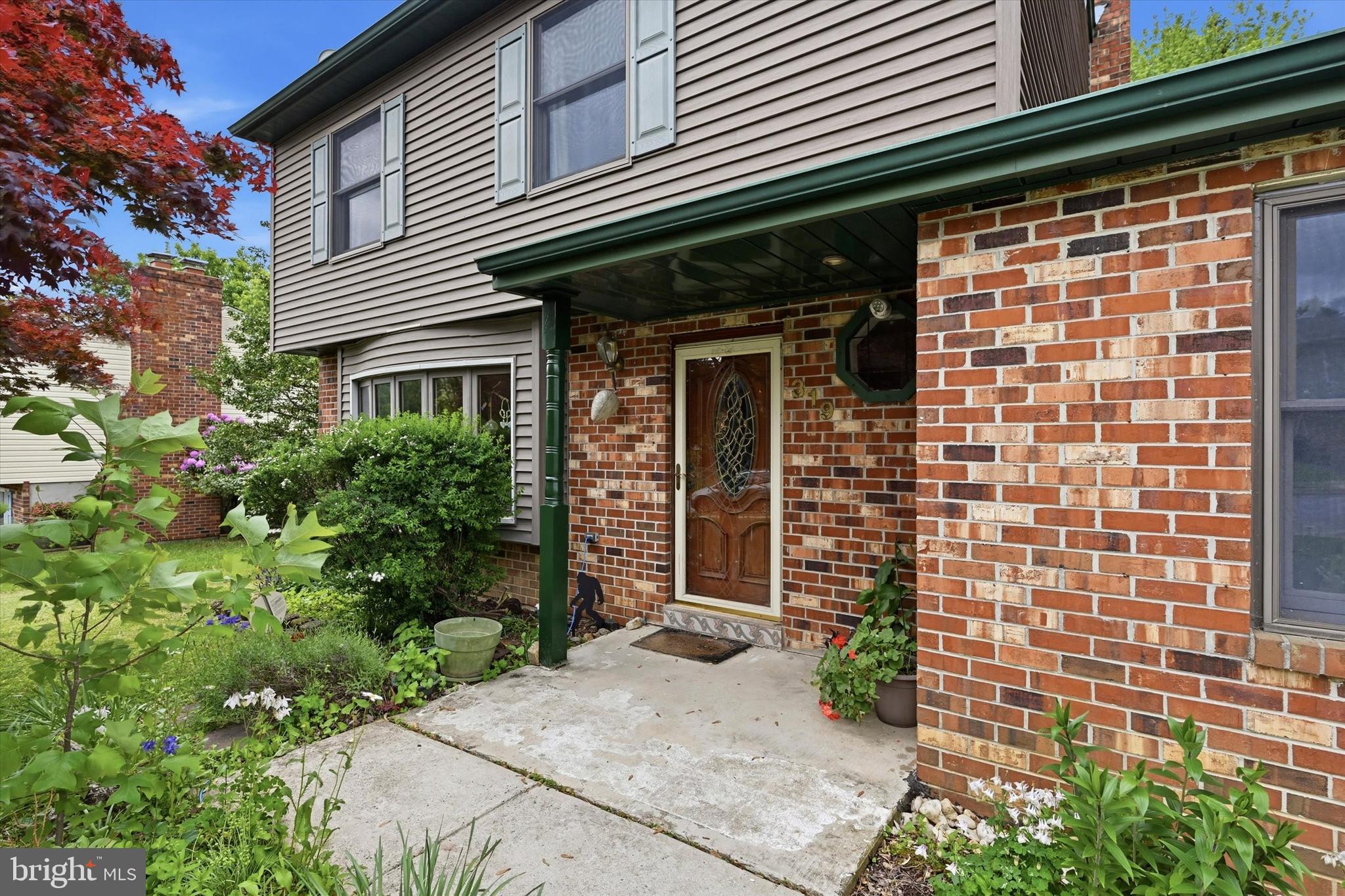 319 Willowbrook Road Upper Chichester, PA 19061 - Photo 2 of 24 a front view of a house with a garage