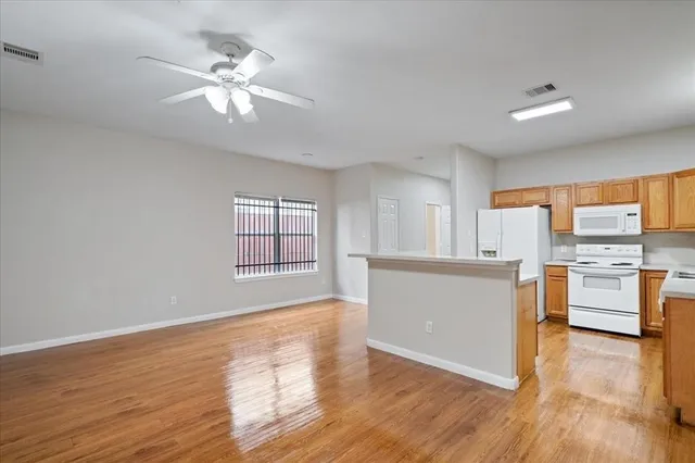 a view of a kitchen with microwave and stove