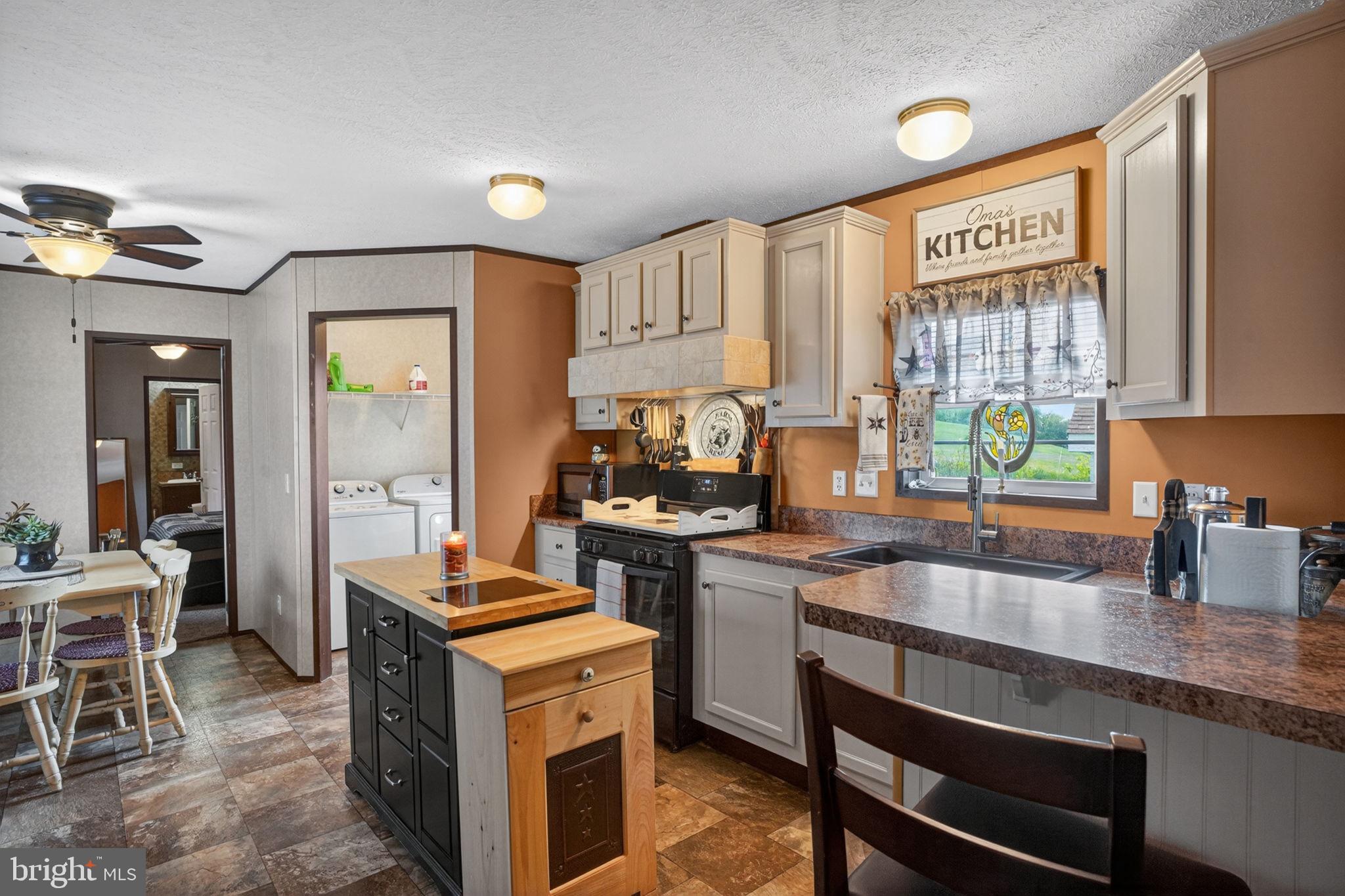39 Country Club Road West Northampton, PA 18067 - Photo 6 of 26 a kitchen with a stove a sink and a refrigerator