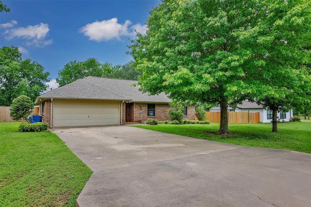 292 Old Spanish Trail Valley View, TX 76272 - Photo 2 of 40 Single story home with a garage, brick siding, driveway, and a shingled roof