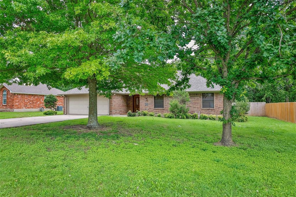 292 Old Spanish Trail Valley View, TX 76272 - Photo 3 of 40 View of front of property with brick siding, driveway, a garage, and roof with shingles