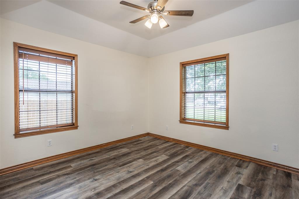 292 Old Spanish Trail Valley View, TX 76272 - Photo 31 of 40 Bedroom room with plenty of natural light, dark wood-style floors, and ceiling fan