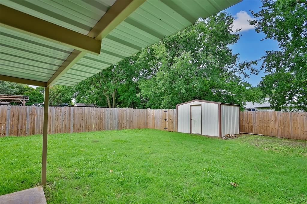 292 Old Spanish Trail Valley View, TX 76272 - Photo 36 of 40 Fenced backyard with a shed