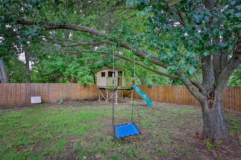 292 Old Spanish Trail Valley View, TX 76272 - Photo 37 of 40 Fenced backyard featuring a playground