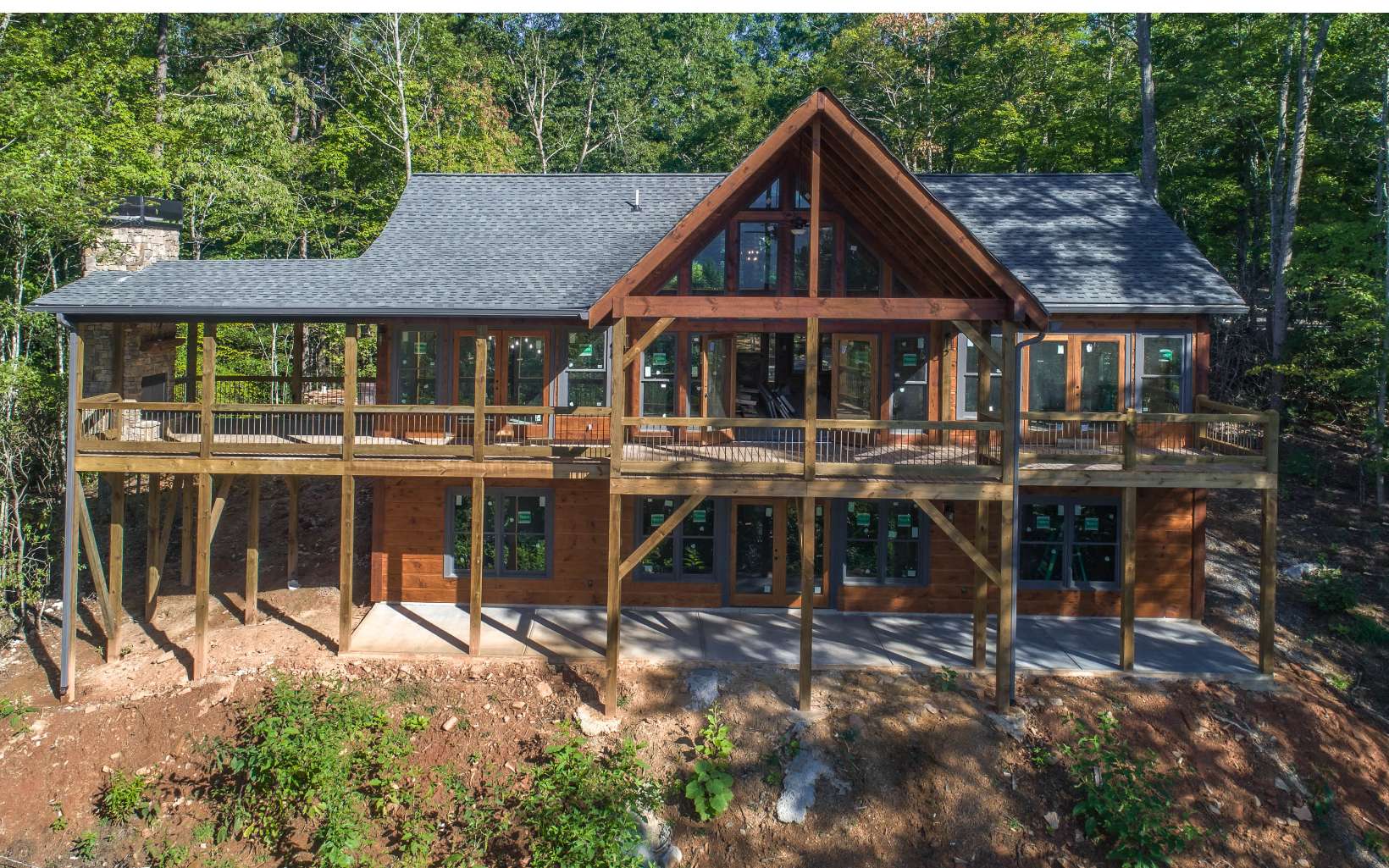 134 Little Hiawatha Trail Blue Ridge, GA 30513 - Photo 1 of 1 a patio with a table and chairs under an umbrella
