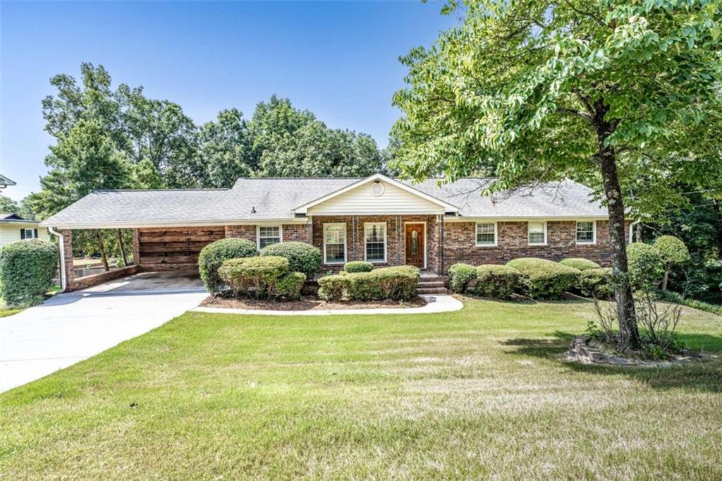 111 Hycliff Road Southwest Rome, GA 30165 - Photo 1 of 1 a front view of a house with a yard