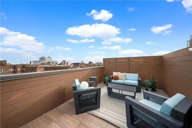a living room with furniture fireplace and a flat screen tv