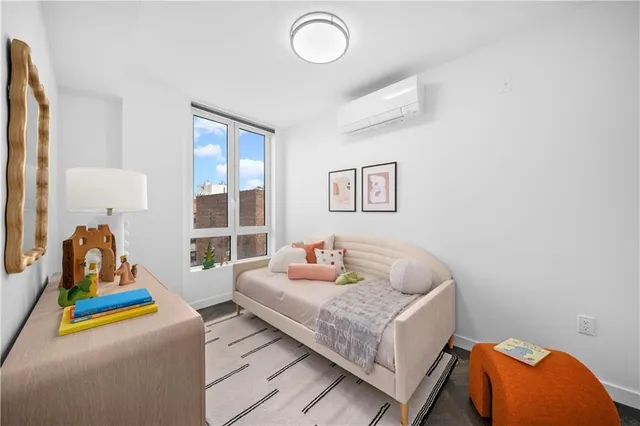 a bathroom with a sink toilet vanity and shower