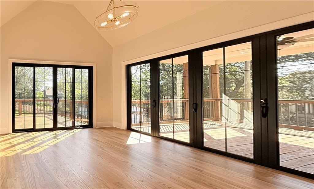 3700 Robinson Road Northeast Marietta, GA 30068 - Photo 11 of 49 a view of an empty room with wooden floor and a window
