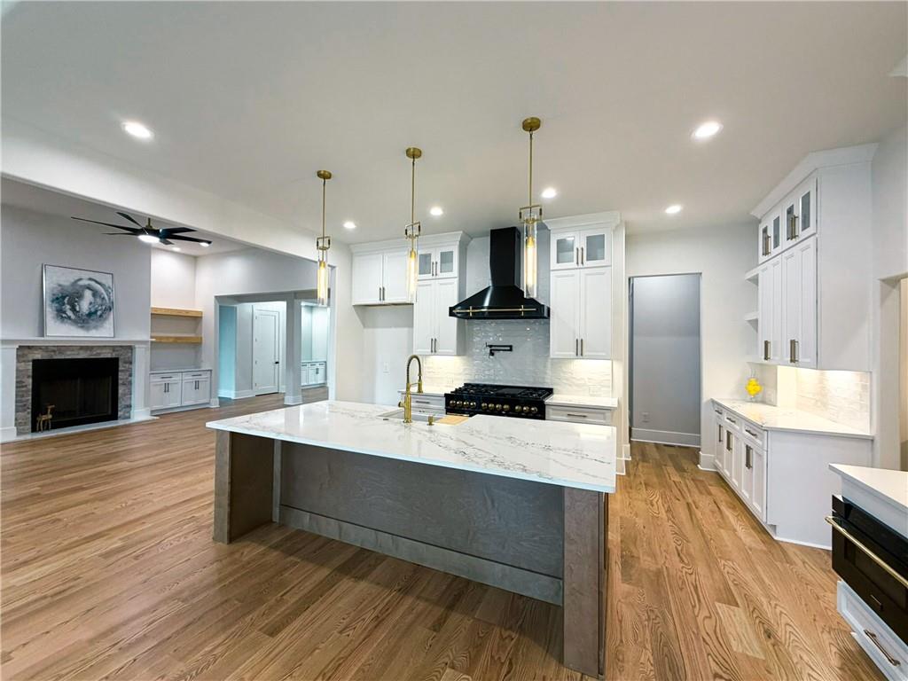 3700 Robinson Road Northeast Marietta, GA 30068 - Photo 15 of 49 a large kitchen with stainless steel appliances kitchen island granite countertop a large island in the center