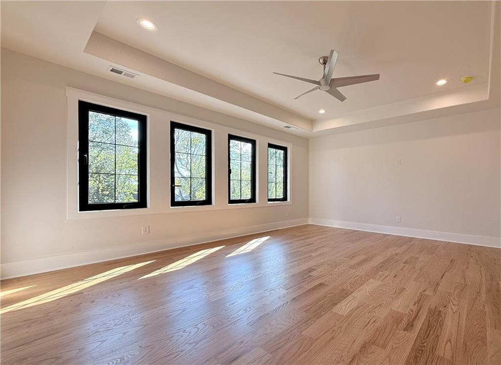 3700 Robinson Road Northeast Marietta, GA 30068 - Photo 27 of 49 a view of an empty room with wooden floor and a window