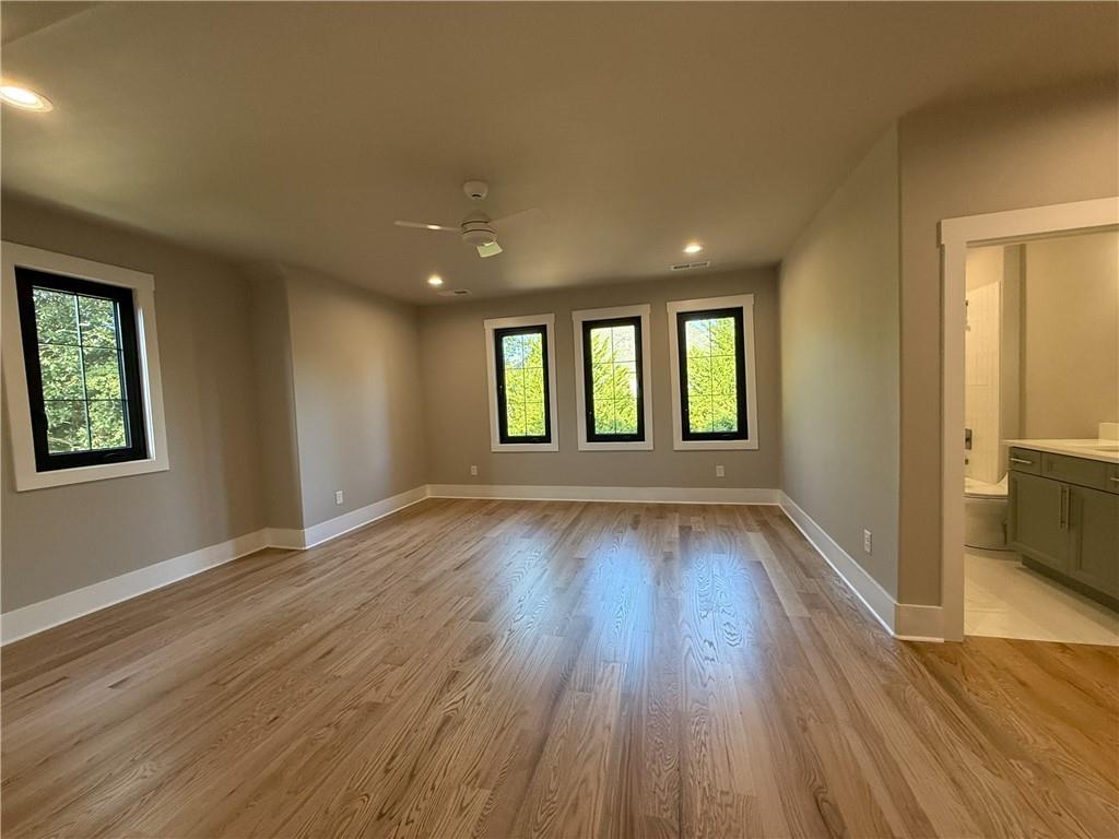 3700 Robinson Road Northeast Marietta, GA 30068 - Photo 30 of 49 an empty room with wooden floor and windows